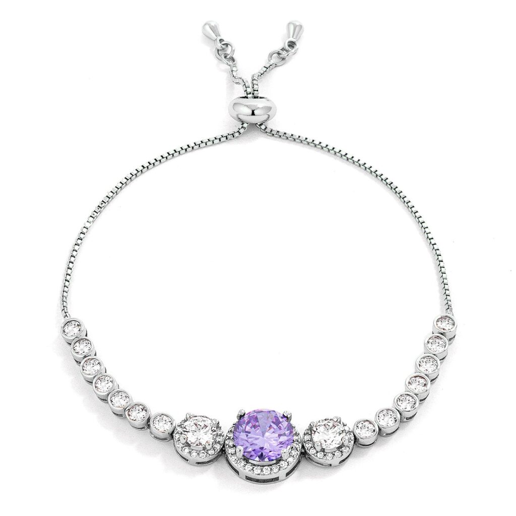 Graduated bolo style tennis bracelet in silver tone over lead free alloy (brass) with round clear and lavender purple cubic zirconia.