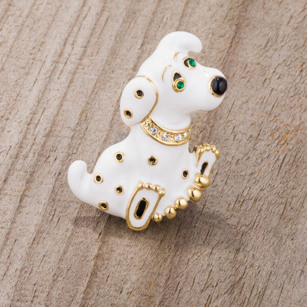 White dalmatian-shaped brooch with crystal accents and a pin backing on a plain background