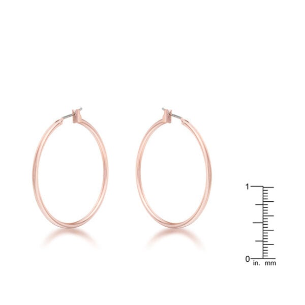 Close view of a single rose gold hoop earring showing its round shape