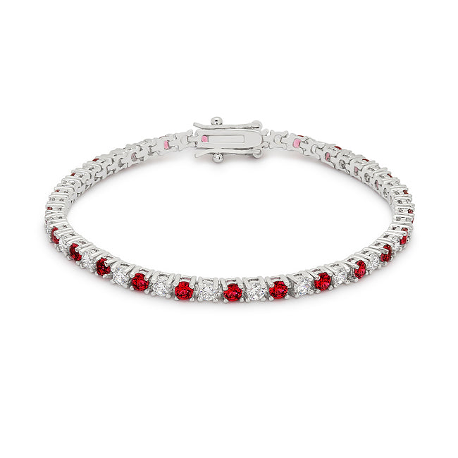 Rhodium plated over lead free alloy (brass) tennis bracelet with round, ruby-colored cubic zirconia in prong settings.