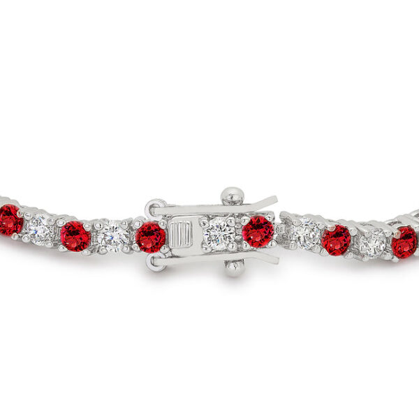 Round, ruby-colored cubic zirconia in prong settings on a rhodium plated over lead free alloy (brass) tennis bracelet.