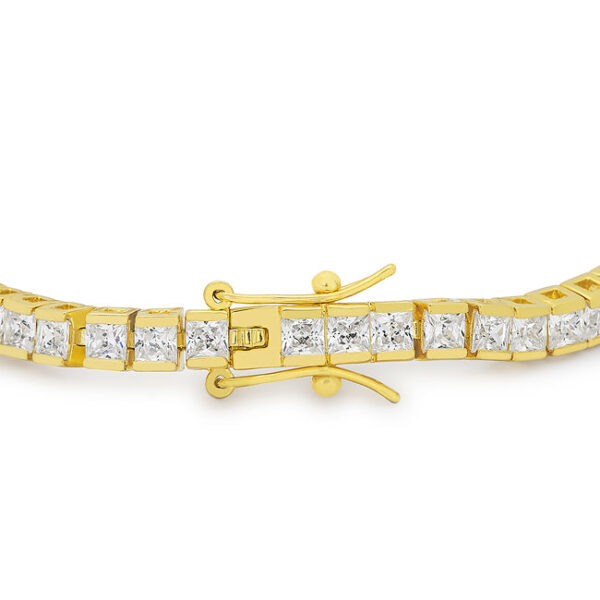 Close-up of prong-set princess-cut cubic zirconia stones on the goldtone finish plated over gold tone bracelet