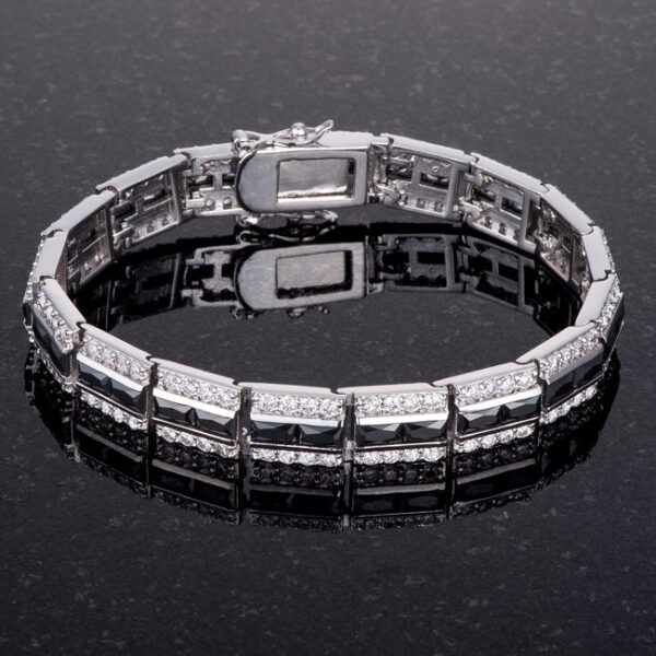 Bracelet with a bright white rhodium plated finish, a lock clasp and onyx-colored cubic zirconia.