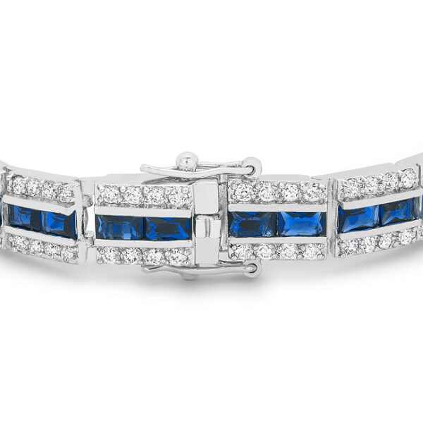 Close-up of prong-set cubic zirconia stones on the bracelet showing round cut and metal finish