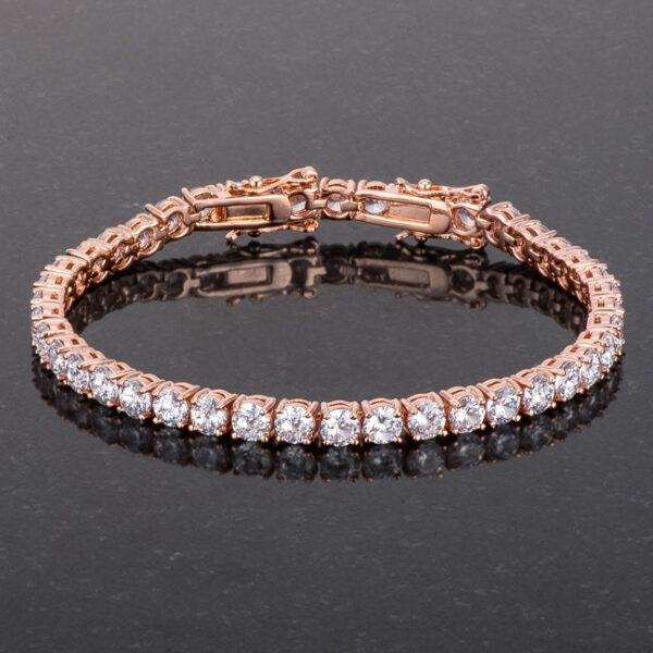 Close-up of rose goldtone links and prong-set round cubic zirconia stones on the bracelet