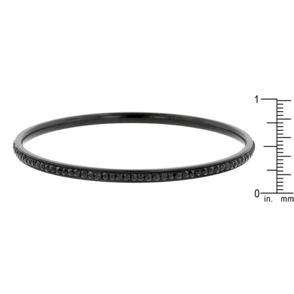 Close-up of the black bangle showing round crystals held in a channel setting