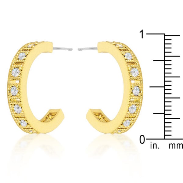 Close-up of a hoop earring showing prong-set blue cubic zirconia and butterfly post backing