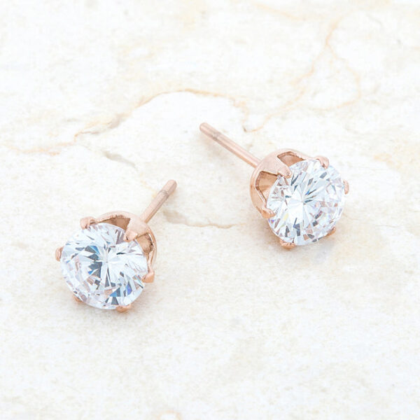 Rose goldtone plated stud earring photographed to show the stone's round cut and surface shine