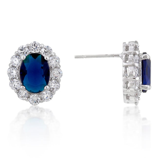 Pair of earrings with blue-toned cubic zirconia stones held by prongs on a rhodium plated finish