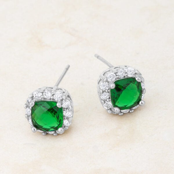 Pair of cushion stud earrings in rhodium plated over lead free alloy (brass) with emerald-colored cubic zirconia.