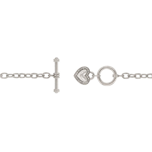 Close-up of round cubic zirconia stones in bezel settings on the heart pendant
