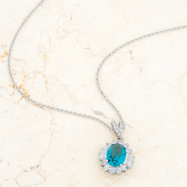 Classic aqua drop necklace in rhodium plated over lead free alloy (brass) with round, prong-set cubic zirconia.