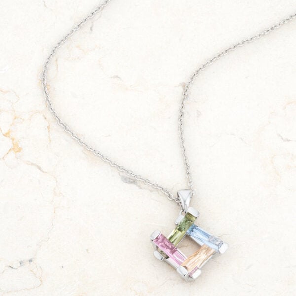 Multicolor necklace in rhodium plated over lead free alloy (brass) with purple radiant-cut cubic zirconia.