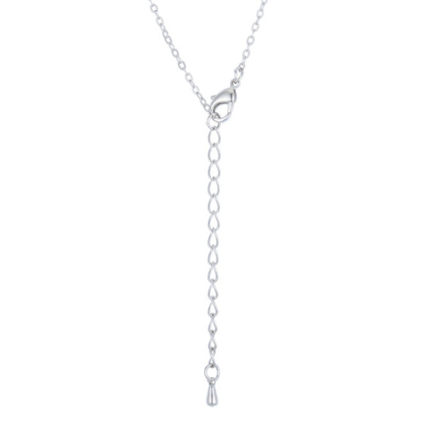Close-up of the pavé-set disk pendant showing the cubic zirconia stones and rhodium tone metal
