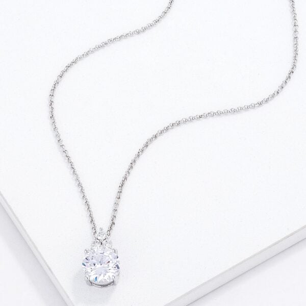 Close angle of the silvertone plated over rhodium plated pendant showing the clear CZ stones and plated metal surface