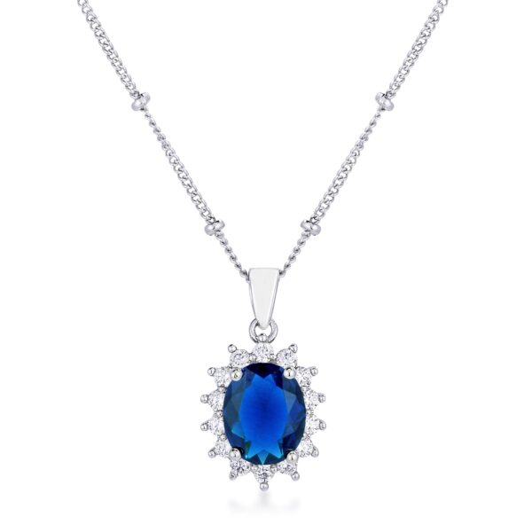 Oval pendant in silvertone plated over rhodium plated metal with a blue stone centered