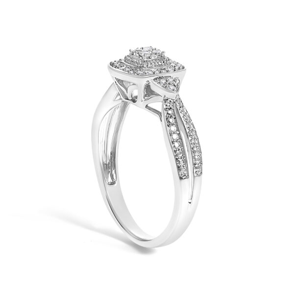 Rhodium plated over gold diamond cluster halo ring with I-J color and I3 clarity diamonds.