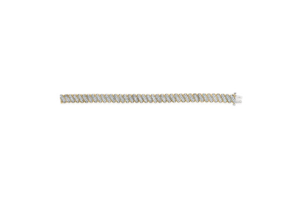 Side angle of the yellow gold S-link bracelet showing the chain's flat profile