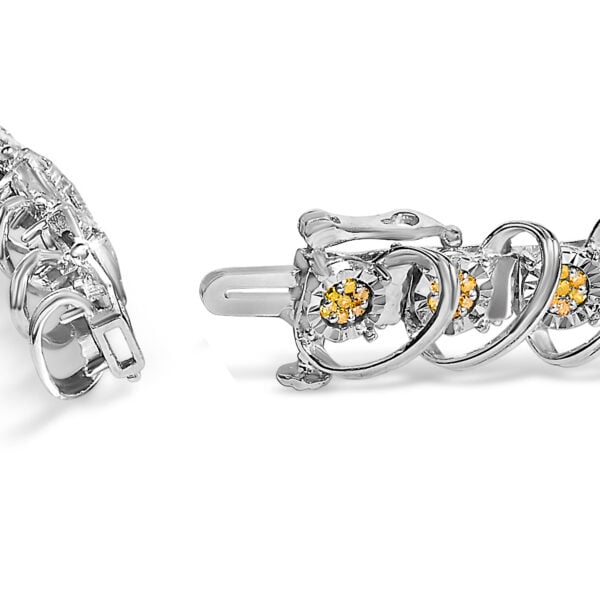 Close-up of illusion plate links showing round yellow diamonds and box clasp