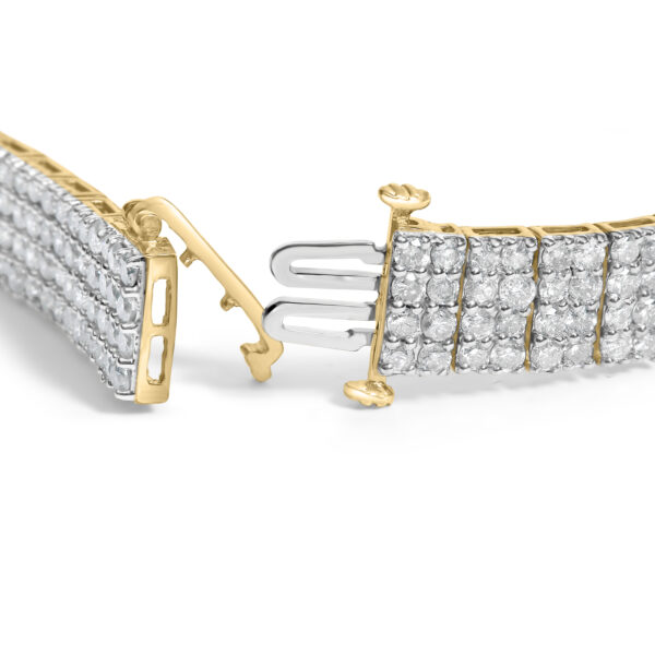 Close-up of round diamonds held in a shared prong setting across the bracelet's four rows