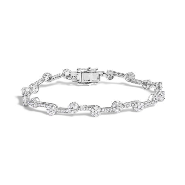 Diamond cluster link bracelet in rhodium plated sterling silver laid flat, showing the full length of stones