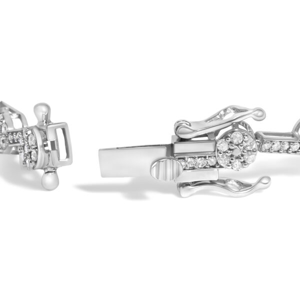 Close view of round diamonds set in prongs along the cluster link bracelet