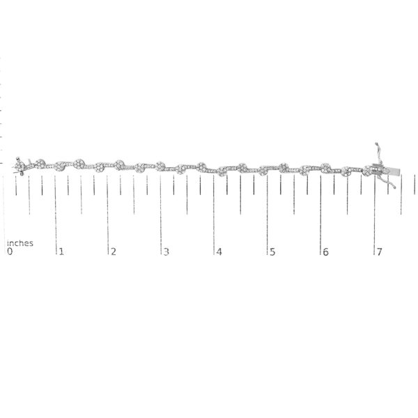 Diamond cluster link bracelet shown next to a scale reference for size comparison