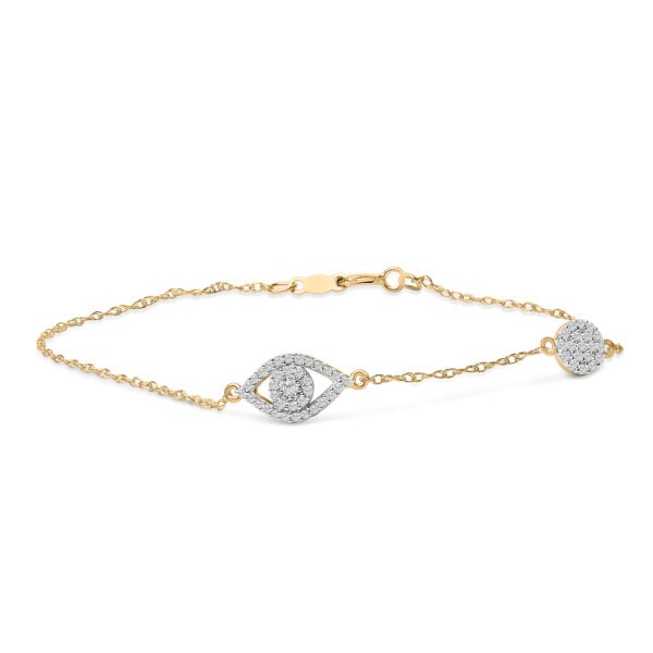 Evil eye station bracelet with round diamonds set in prongs along a 14K gold plated silver chain