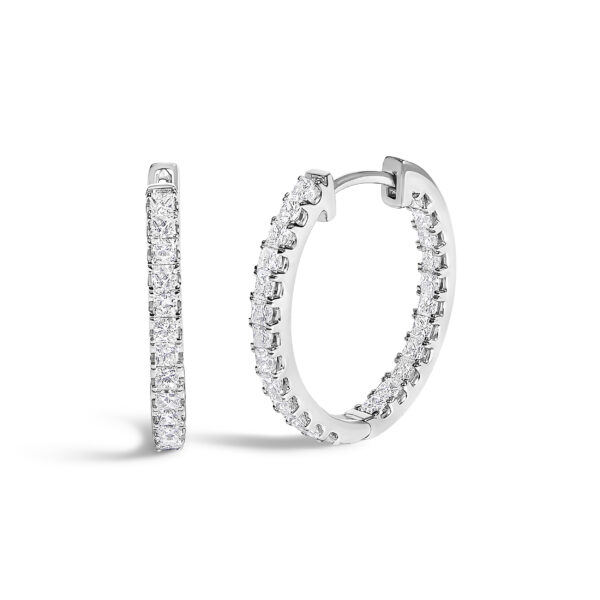 Pair of elongated hoop earrings with princess-cut diamonds set along the inside and outside curve