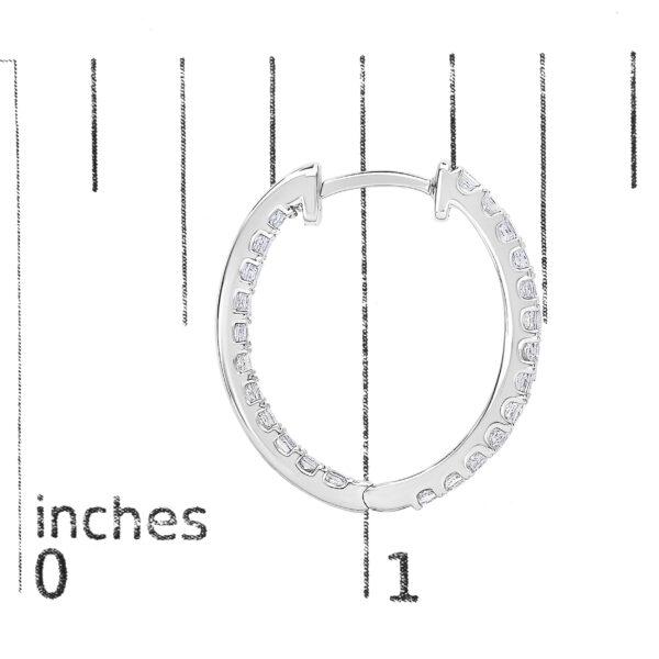 Diamond hoop earring shown next to a scale reference to indicate its size