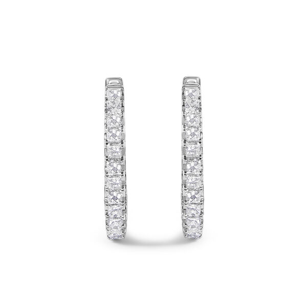Close view of a single hoop earring showing prong-set princess-cut diamonds
