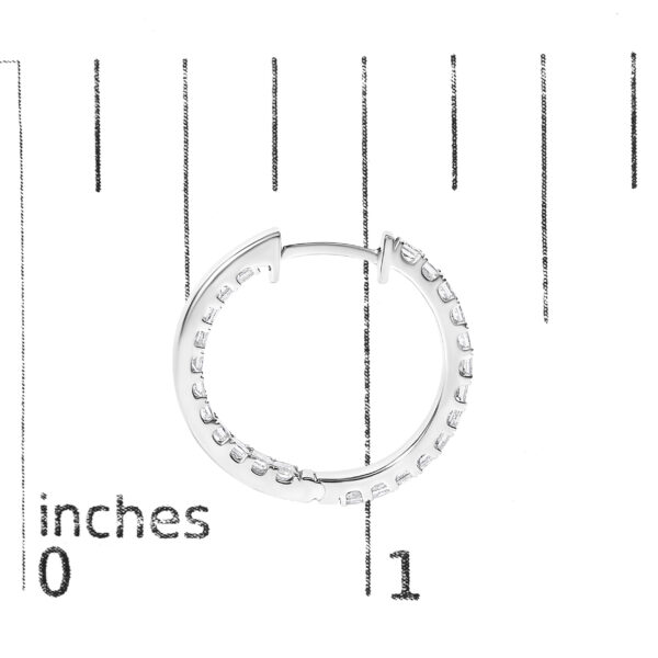 Hoop earrings shown next to a scale reference for size comparison