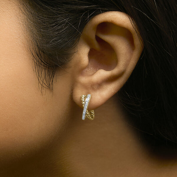 Model wearing the twisted diamond hoop earring