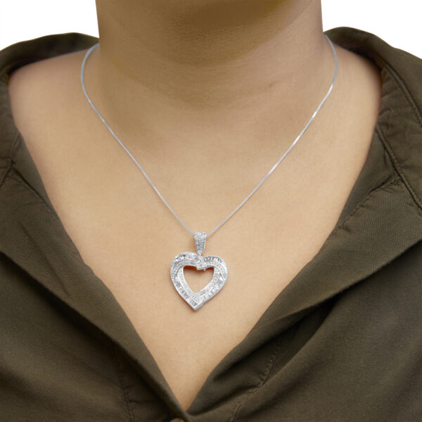 Open heart diamond pendant necklace worn on a model to show placement on the neckline
