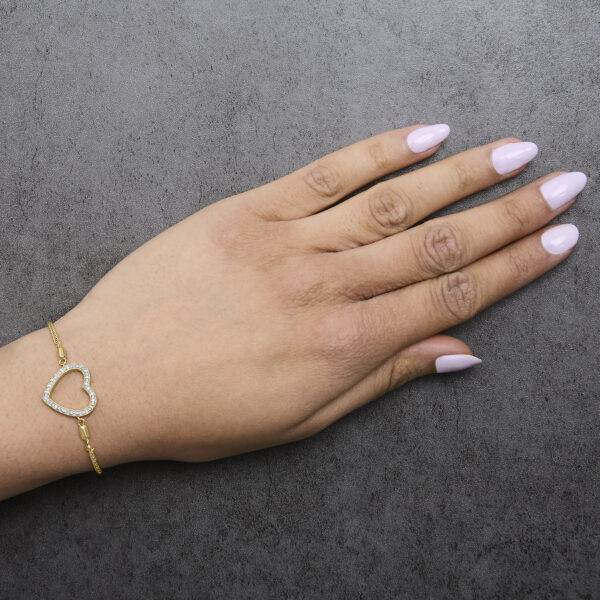 Gold vermeil diamond heart bolo bracelet worn on a wrist
