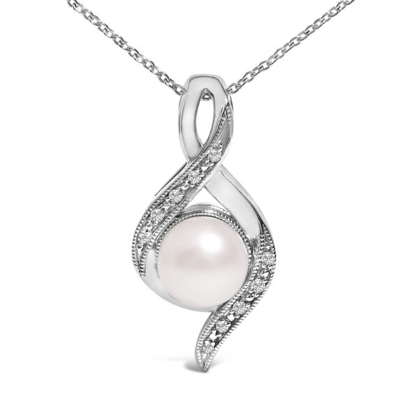 Close view of the pendant's swirl metalwork and pave-set diamonds