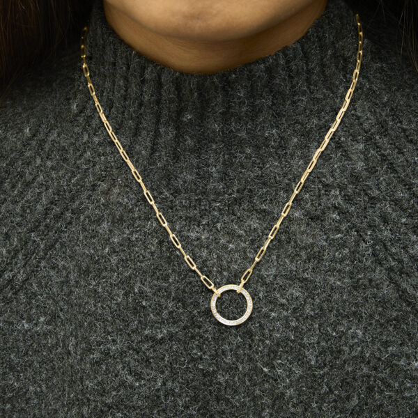 24K gold plated sterling silver paperclip chain circle pendant necklace worn on a model's neckline