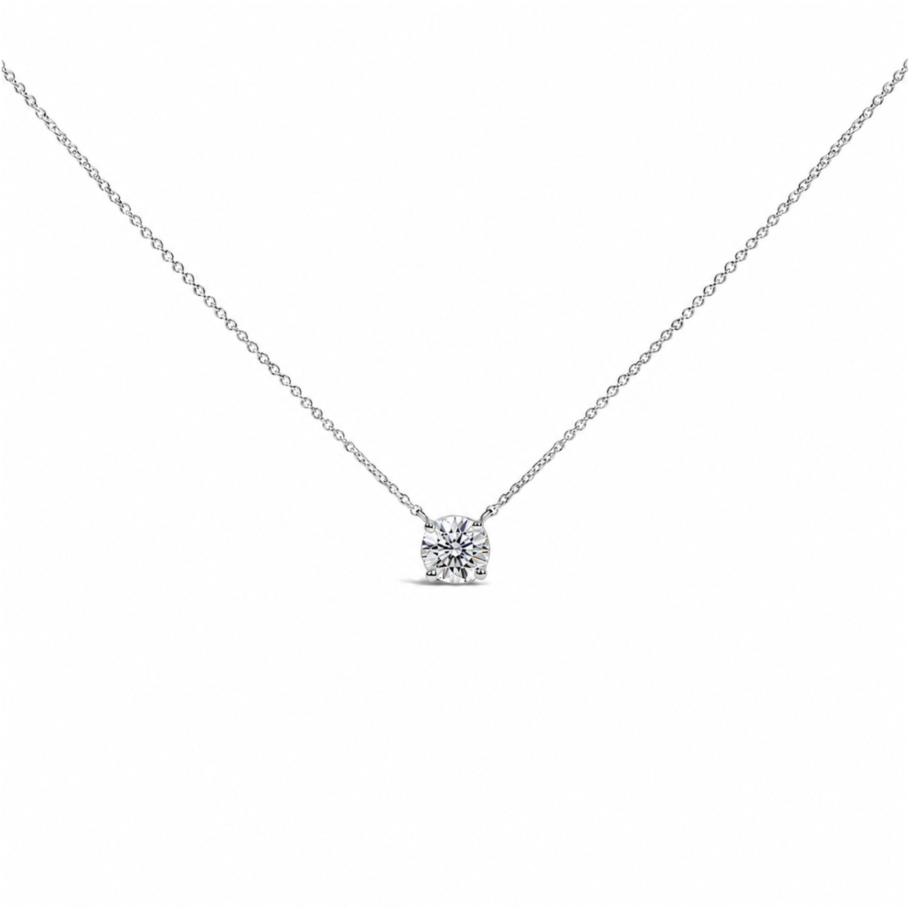 Round solitaire diamond pendant in 14K white gold on a cable chain, shown against a plain background