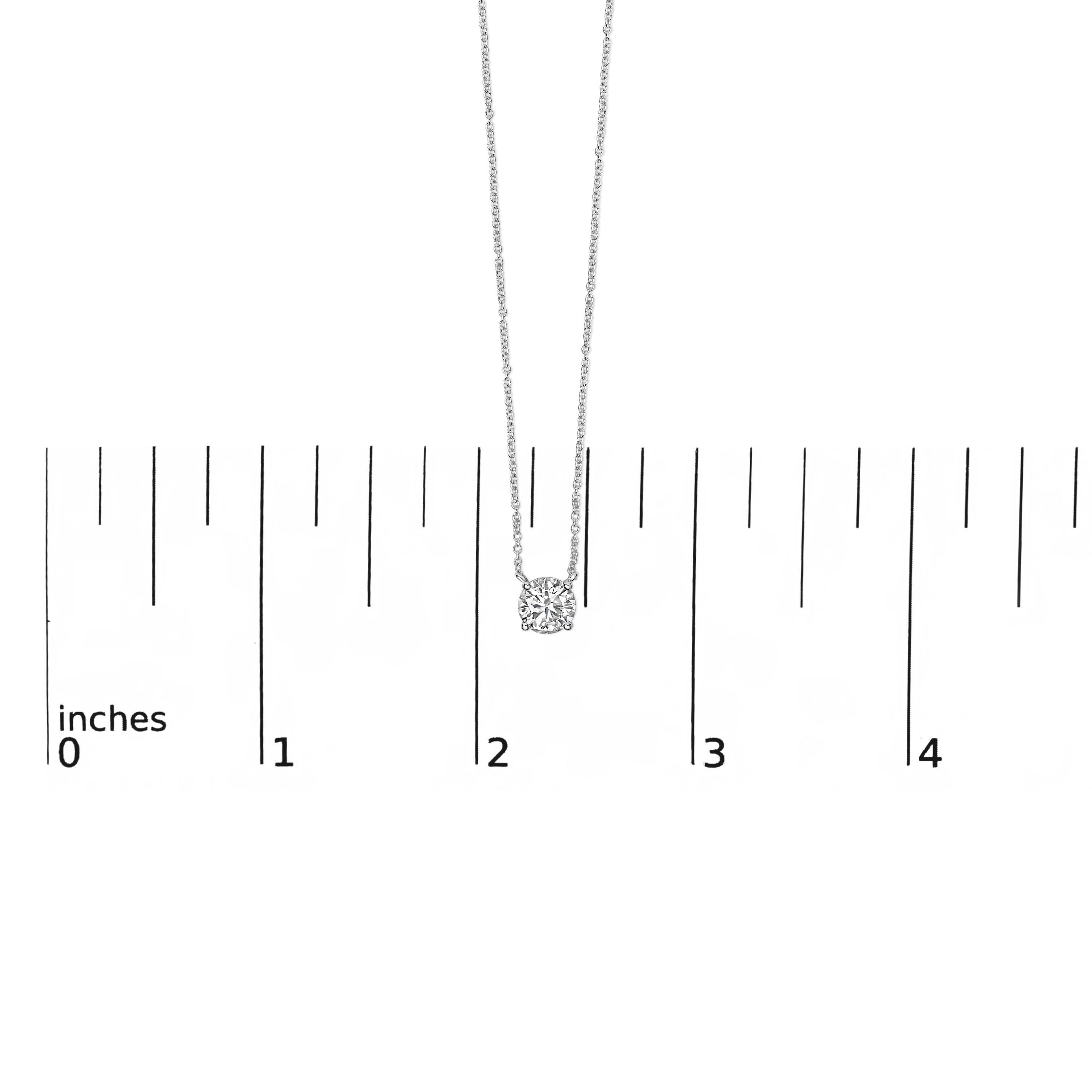 Diamond pendant shown next to a scale reference to indicate its actual size