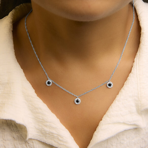 Necklace worn on a model showing how the stations sit along the neckline