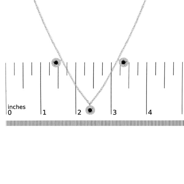 Necklace shown next to a ruler for scale reference