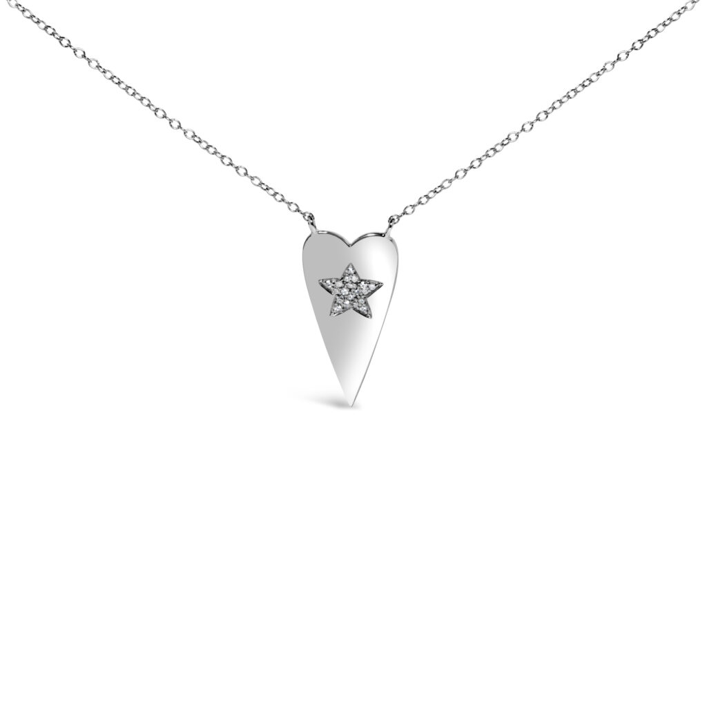 Heart pendant with a diamond-set star at its center, on a cable chain