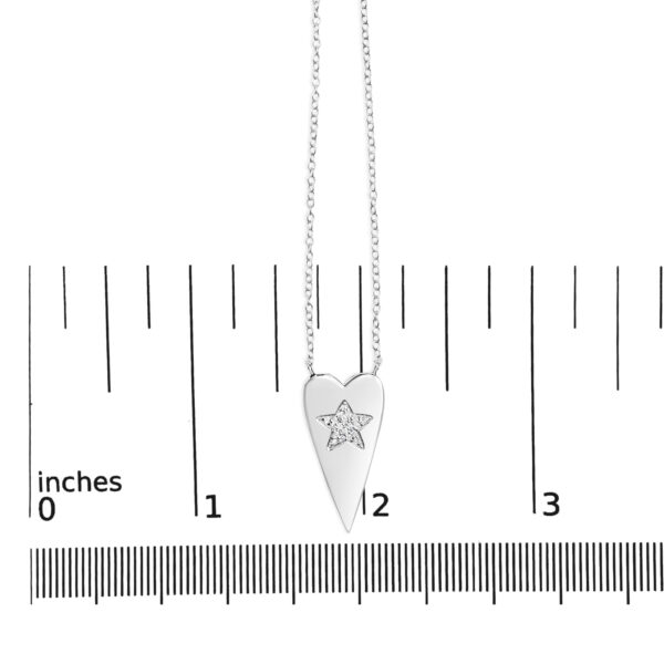 Pendant shown next to a scale reference to indicate its size