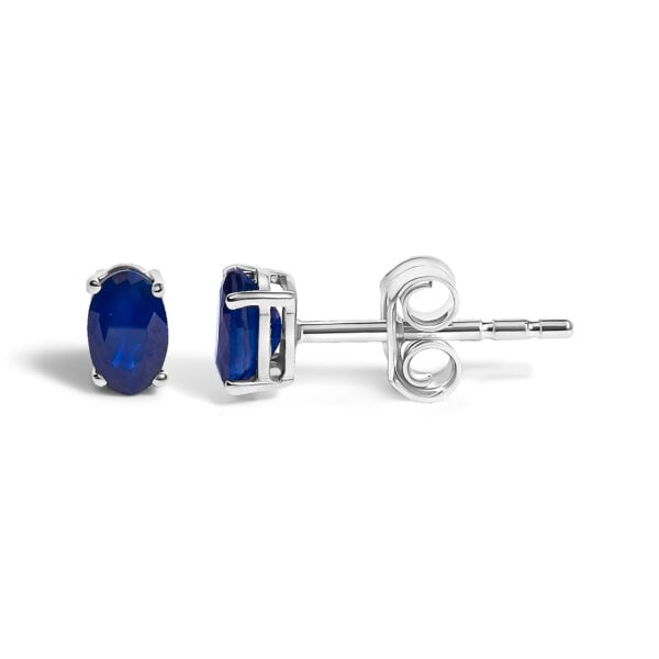 Angled view of the sapphire stud earrings showing the push back closures