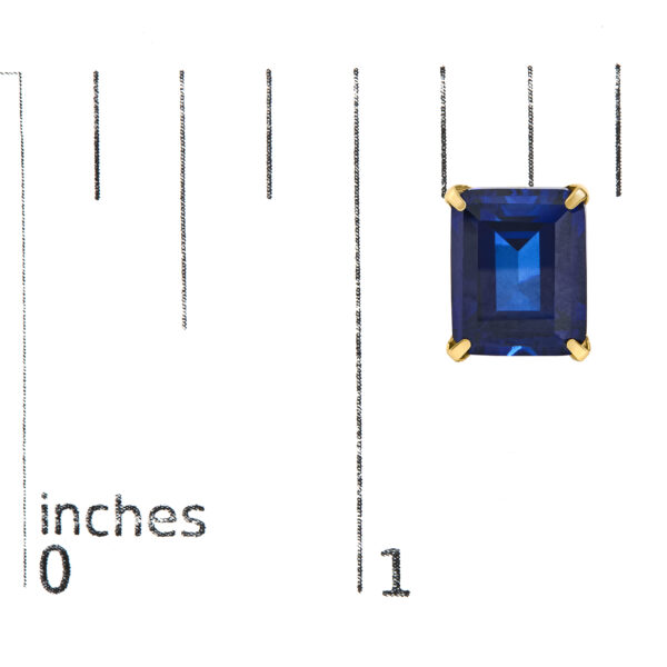 Stud earrings shown next to a scale reference indicating the 8 x 10mm stone size