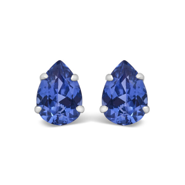 Pair of platinum pear-shaped blue sapphire stud earrings on a plain background