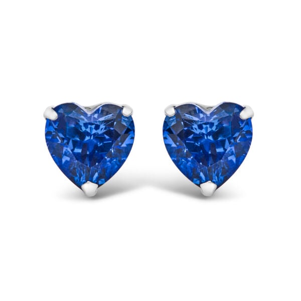 Pair of platinum stud earrings with heart-shaped blue sapphires, front view on white background