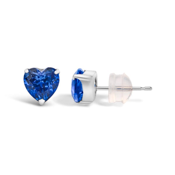 Close-up of a single platinum stud earring with a heart-cut blue sapphire