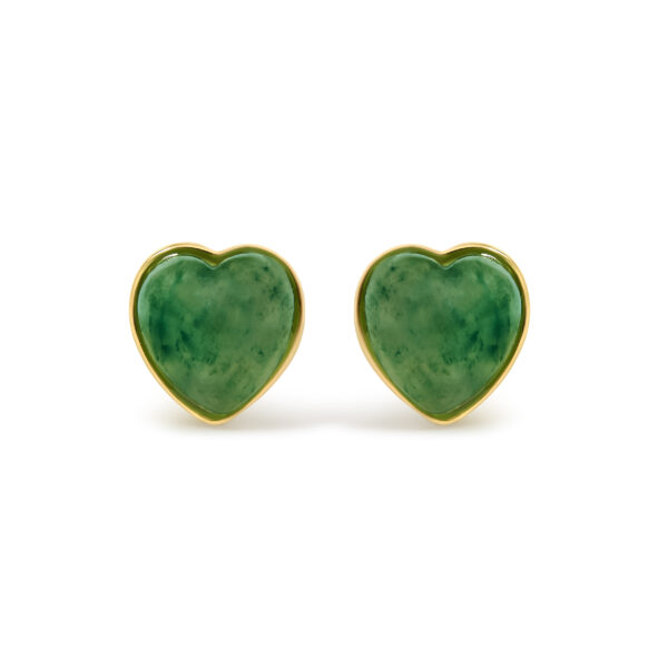 Pair of heart-shaped green jade stud earrings set in yellow gold, shown face-on against a plain background