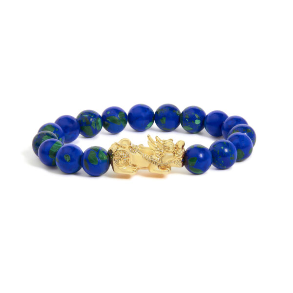 Bracelet strung with round azurite cabochon beads and a yellow gold dragon charm at center